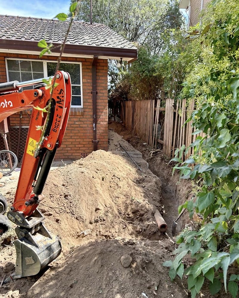 Trench Dug Beside A Brick House — Brock Plumbing